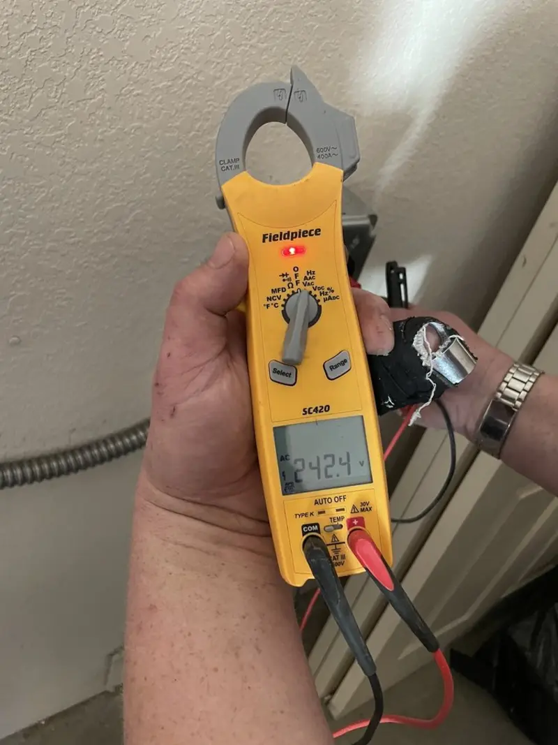 Voltage testing with clamp meter during Recessed Lighting Installation in Eureka